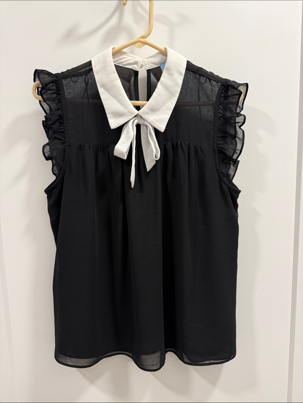 CeCe Black Sleeveless Blouse with White Tie Collar